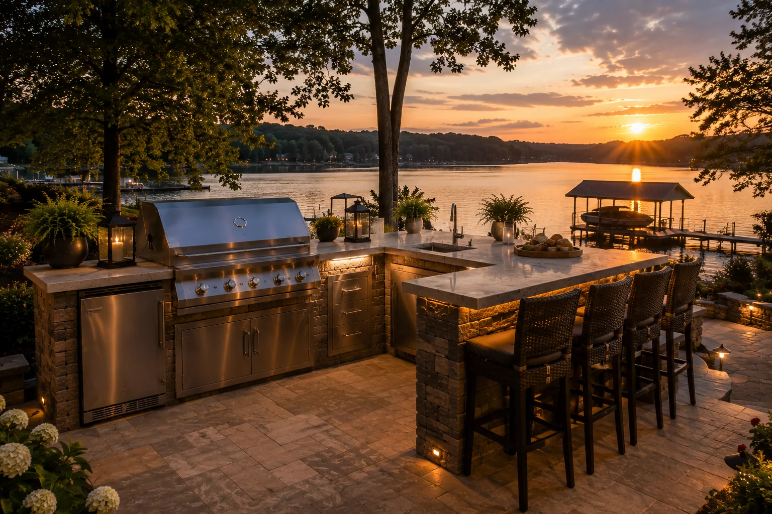 Lakefront outdoor kitchen and bar at sunset